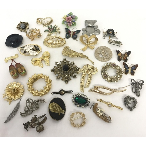 1008 - A collection of vintage brooches of various designs, some stone set. To include examples by Movitex ... 