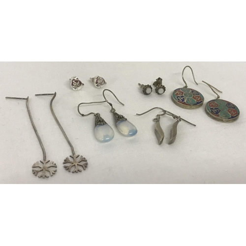 1010 - 6 pairs of silver and white metal earrings in drop and stud styles. To include a pair of moonstone d... 