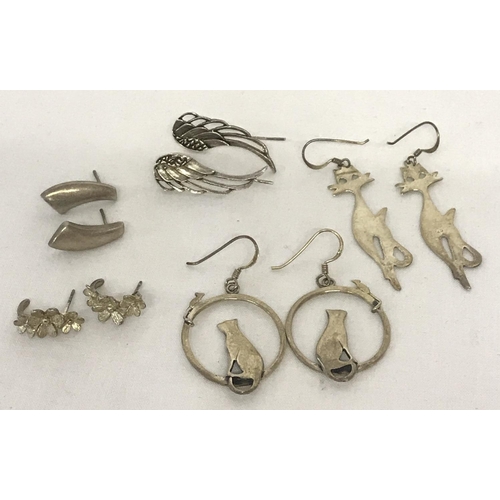 1021 - 5 pairs of drop style silver earrings. To include angel wings, cats and cat & mouse designs.