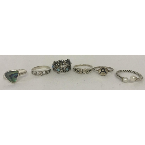 1024 - 6 silver and white metal dress rings. To include abalone shell , pearl and opal set.  Sizes range fr... 