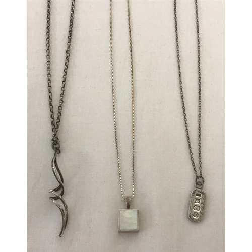 1027 - 3 silver necklaces. A twist design pendant on a fine belcher chain. Together with a silver ingot on ... 