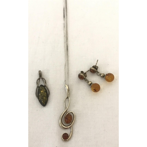 1028 - 3 items of amber set silver jewellery.  A treble clef pendant on a 18