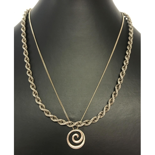 1029 - 2 silver necklaces. A rope style chain together with a circular design pendant on a fine curb chain.