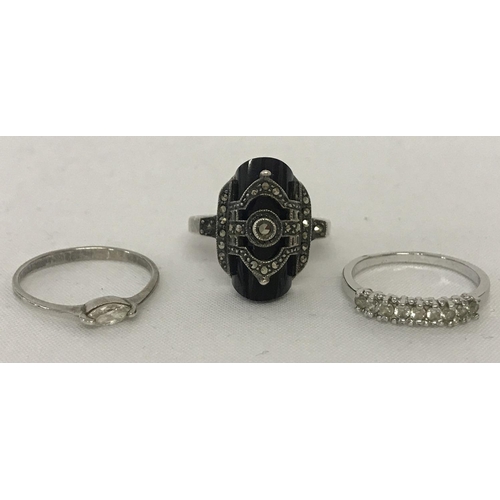 1041 - 3 stone set silver and white metal dress rings. An Art Deco style set with half cylinder cut onyx an... 