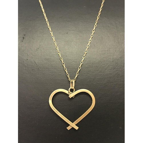 1042 - A 9ct gold open heart pendant on a 9ct gold fine rope chain approx. 20