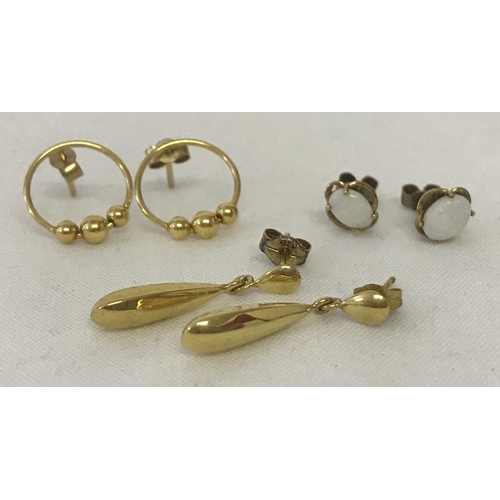 1056 - 3 pairs of 9ct gold earrings. A pair of oval gold drops, together with a pair of opal set studs and ... 