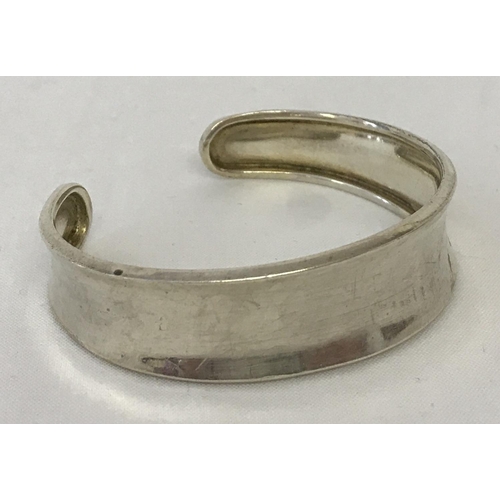 1163 - A 925 silver cuff bangle. Hallmarks to inside rim.  Total weight approx. 10.1g.