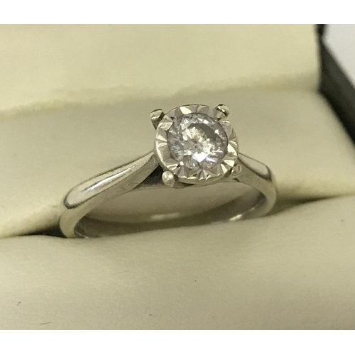 1164 - A 9ct white gold diamond solitaire ring. Diamond .33ct. Full hallmarks to inside of band. Size K. To... 