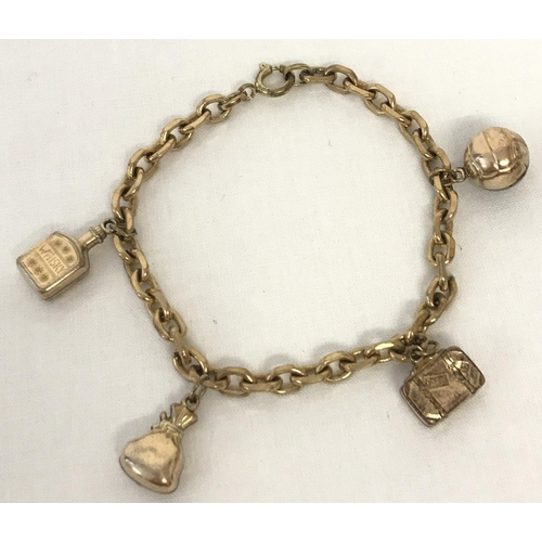 1167 - A vintage rolled gold charm bracelet with 4 charms. A whisky bottle, suitcase, football and a sack. ... 