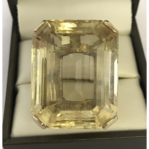 1170 - A very large emerald cut Citrine and 9ct gold dress ring. Citrine approx. 12+ ct. Stone surface meas... 