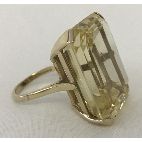 1170 - A very large emerald cut Citrine and 9ct gold dress ring. Citrine approx. 12+ ct. Stone surface meas... 