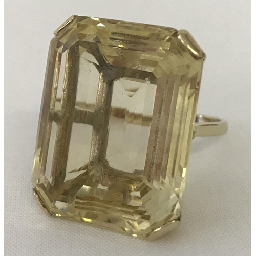 1170 - A very large emerald cut Citrine and 9ct gold dress ring. Citrine approx. 12+ ct. Stone surface meas... 