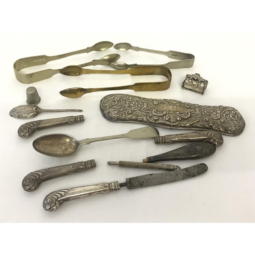 1184 - A small collection of silver and silver plate items. To include a clothes brush back Hallmarked Ches... 