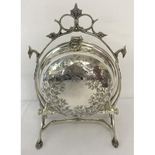 1196 - A silver plated folding muffin dish, in the style of a Victorian 2 sectional dish. With ornamental h... 