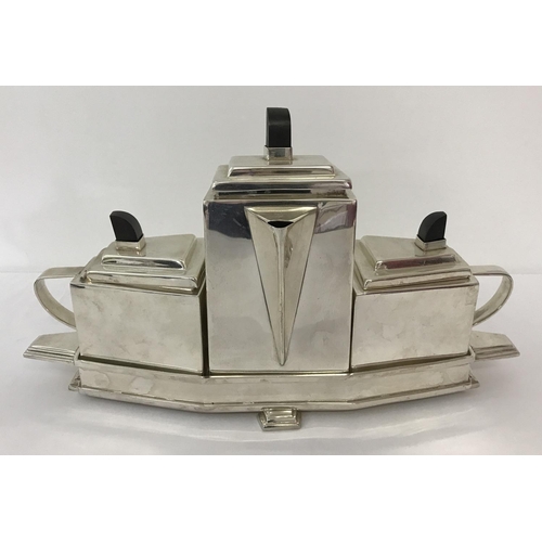 1197 - An Art Deco style 4 piece silver plated tea set. Comprising: teapot, milk jug and sugar bowl with wo... 