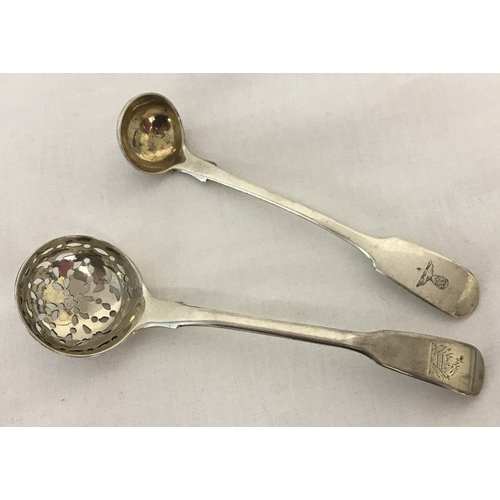 1221 - A Georgian silver sugar sifter spoon, hallmarked Solomon Hougham 1815. Crest to handle. Together wit... 