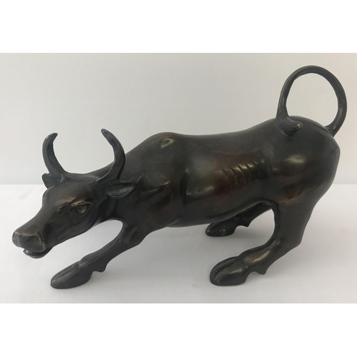 1238 - A hollow bronze figurine of a bull.  Approx. 18cm tall x 30cm long.