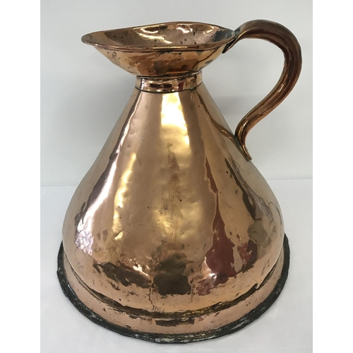 1265 - An antique copper 4 gallon haystack jug with riveted handle and dovetail joint.  Approx. 40cm tall.