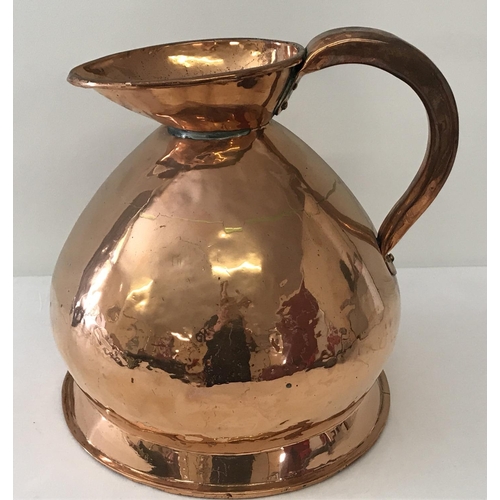 1277 - An antique copper 2 gallon ale jug of bulbous form. With riveted handles and dovetail joint. Approx.... 