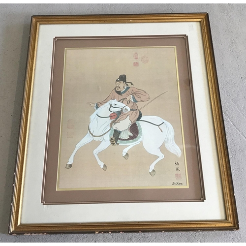 1331 - A large signed Japanese print of a horseman. Gilt framed and glazed. Approx. 92cm x 78cm.