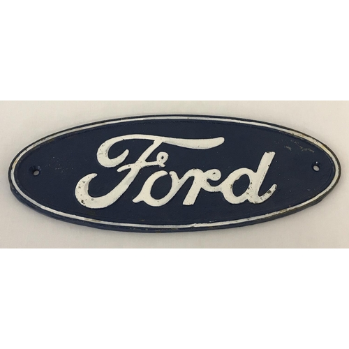 1355 - An oval shaped painted cast iron Ford wall plaque, in blue and white.  Approx. 11cm x 29.5cm.