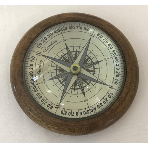 1396 - A wooden framed glass dome topped desk compass.  Approx. 10cm diameter.