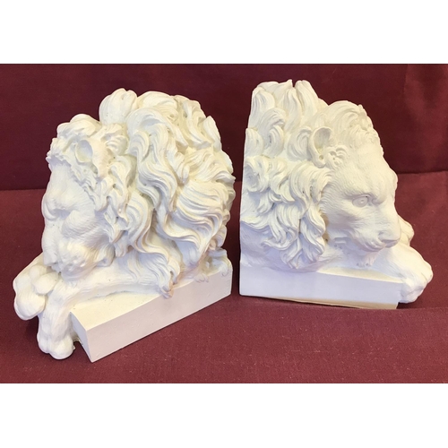 1397 - A pair of white alabaster lion shaped book ends.  Each approx. 14cm tall x 12 cm long.