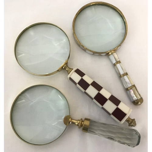 1399 - 3 large magnifying glasses, one with a chunky faceted glass handle. And one with brass banding and m... 