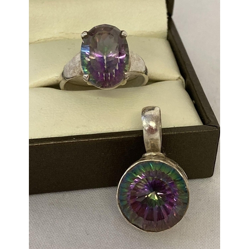 1004 - 2 pieces of 925 silver and mystic topaz set jewellery. A circular shaped pendant with pierced work d... 