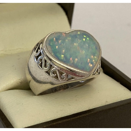 1017 - A 925 silver dress ring with pierced work detail and set with heart shaped opalite stone.  Ring size... 