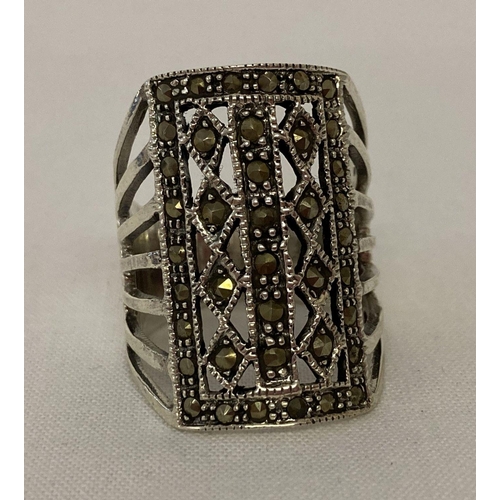 1025 - An Art Deco style silver and marcasite cocktail ring. Marked 925 inside band. Ring size Q.