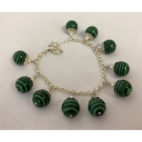 1032 - A white metal and malachite bracelet, clasp needs attention. A 7