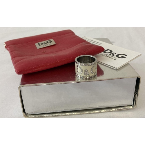 1057 - A Dolce & Gabbana band style dress ring with original box, red leather effect pouch. Complete with C... 