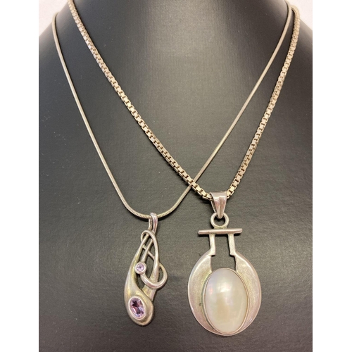 1078 - 2 925 silver stone set pendants on chains. An Art Nouveau style pendant set with amethyst stones on ... 