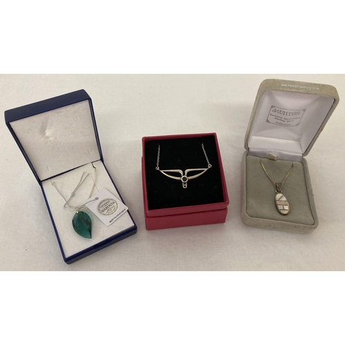 1079 - 3 boxed 925 silver necklaces. A Swarovski Crystals green leaf pendant on a 17