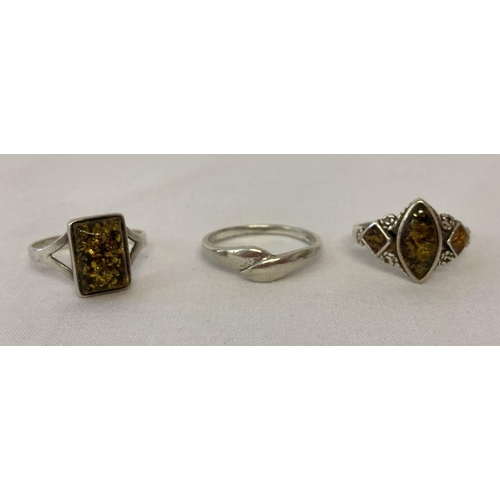 1088 - 3 silver dress rings. 2 set with green amber and a twist style band ring. All marked 925. Sizes R, Q... 