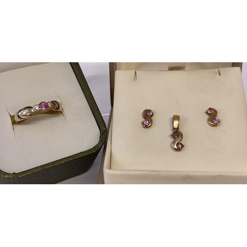 1095 - A 9ct gold diamond and pink sapphire matching dress ring, earrings and pendant. Central round pink s... 