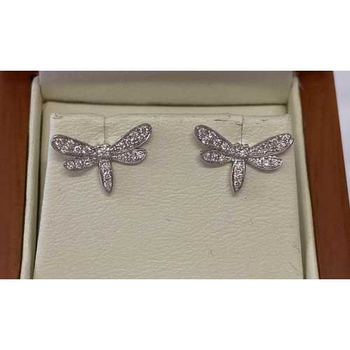 1110 - A pair of 18ct white gold and diamond set dragonfly stud style earrings, possibly Luke Stockley. LSJ... 