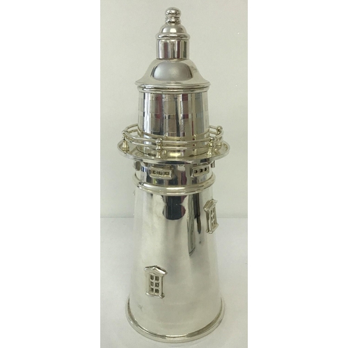 1139 - A large silver plated cocktail shaker in the shape of a lighthouse.  Approx. 35cm tall.