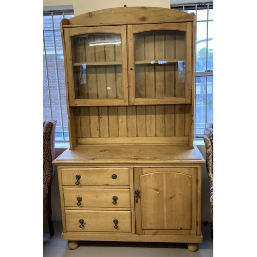 1611 - A vintage pine double dresser with glass fronted doors to top. 2 sectional dresser with cupboard and... 