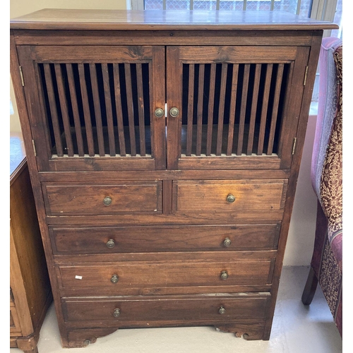 1613 - A dark wood 5 drawer, 2 door cabinet with slatted panel door fronts and brass handles.  Approx. 119c... 