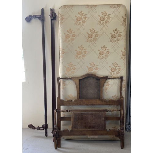 1626 - An early 20th century single sized bed frame with wooden & casework head and foot board. Complete wi... 