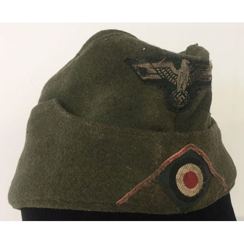 114 - A WWII style German Panzer grenadier's M34 overseas cap. Indistinct mark to inside.