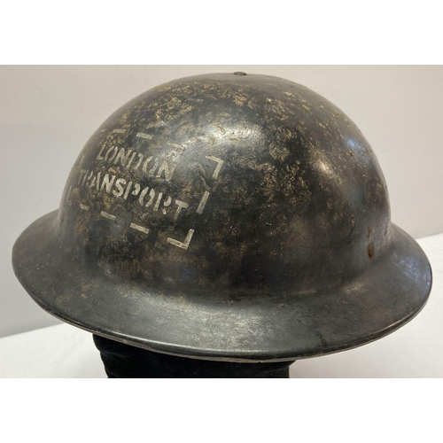 118 - A WWII style London transport Bakelite helmet.