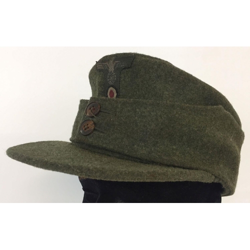 121 - A WWII style German army M42 field/ski cap. With early button design.