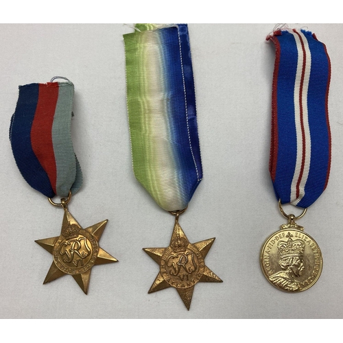 374 - A WWII George VI Atlantic Star medal together with a WWII George VI 1939-1945 Star medal and a Eliza... 