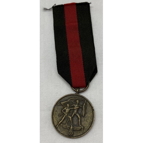 376 - A WWII style German Sudetenland medal on ribbon.