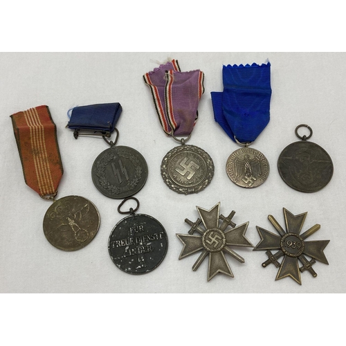 377 - A collection of various German WWII style medals.