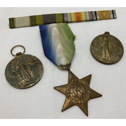 378 - 3 British WWII style medals together with a ribbon bar.