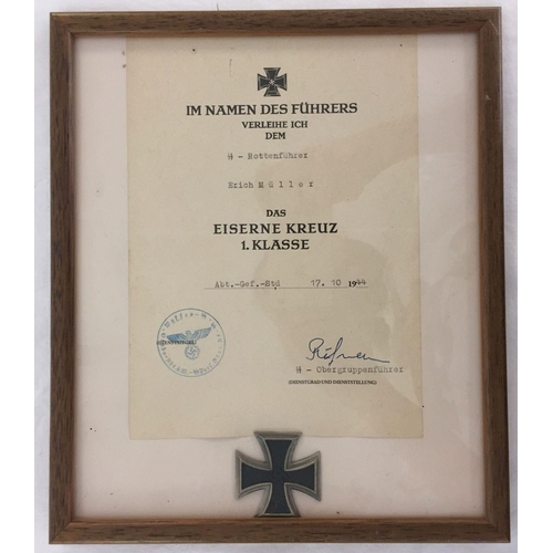 380 - A WWII style framed and glazed Waffen SS Iron Cross first class EK1 and award certificate.  Frame si... 